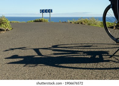 Shadow Of A Bike On A Road At Lanzarote Island In Spain