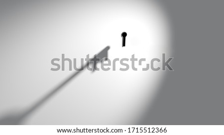 Shadow cast by abstract imaginary key approaching or moving towards keyhole in wall	