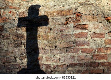 Shadow Of A Cross On A Wall