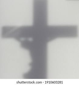 Shadow Of Crucifix Cross On Wall