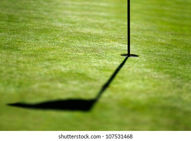 Shadow Of A Flag On Golf Field