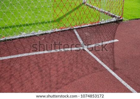 Similar – Leerer Tennisplatz mit Ballwagen und leuchtend rotem Belag