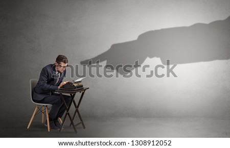 Shadow hand pointing at a small afraid worker
