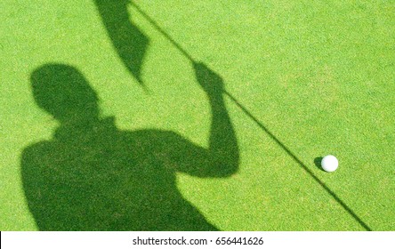 Shadow Of Helper Assistance Holding Golf Flag Hole