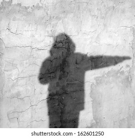 Shadow Of A Man On The Wall