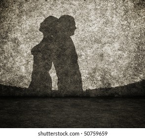 Shadow Of The Man And The Woman On Dirty Wall