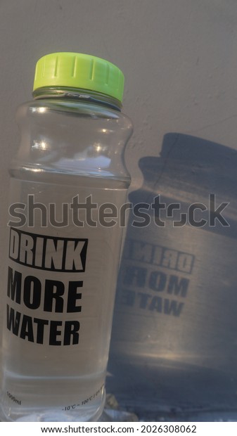 the shadow of a mineral\
water bottle