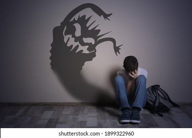 Shadow Of Monster On Wall And Scared Boy In Room