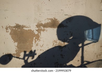 Shadow Motorcycle And Helmet On The Wall