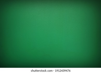 The shadow of the old green cement wall surface