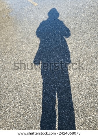 Shadow of a woman on the beach