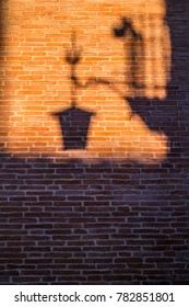 Shadow on red brick wall