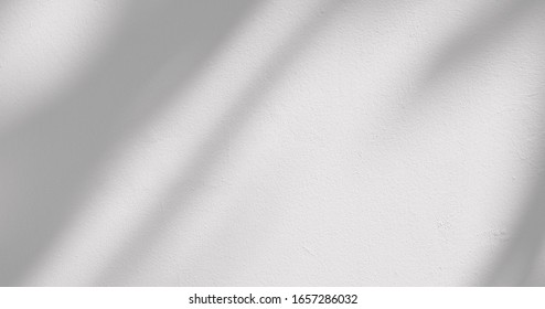 Shadow On White Concrete Wall In The Room From Window With Morning Light