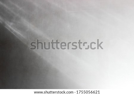 Shadow on white wall. Greyscale concept with light and shadow. Gradient white,grey,black background.