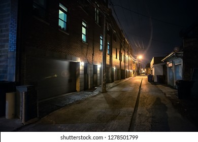 Shadow Of A Person In A Dark Scary Alley At Night