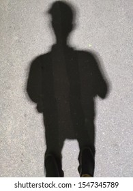 shadow of a person posing