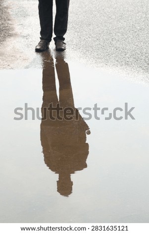 shadow and reflection of a human being