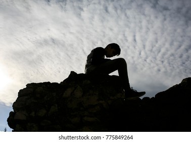 Shadow shape of a sited boy