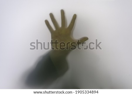 Similar – man hand shadow shilhouette and rainbow on the wall