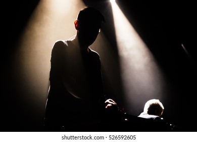 Shadow of the singer in the light