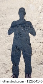 Shadow Of Sportive Man On Sand