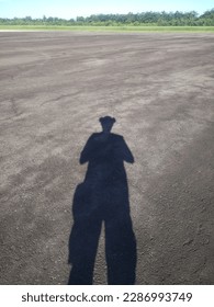 
a shadow that is waiting for the arrival of a cloud so that it can make the shadow disappear