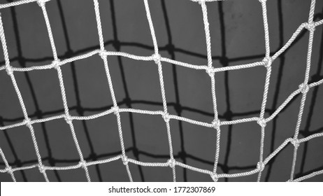 the shadow of these white 
nets is reflected 