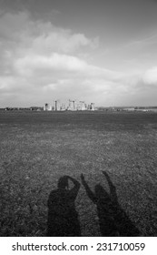 Shadow Of Tourists At Stonehenge, England.