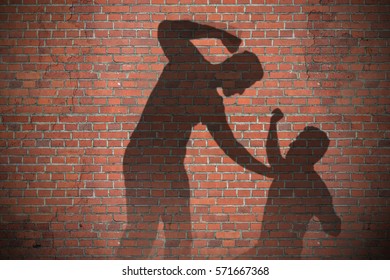 Shadow Of Two Men Fighting On Brick Wall