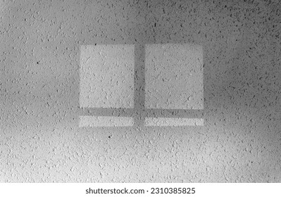 The shadow of the window on the wall