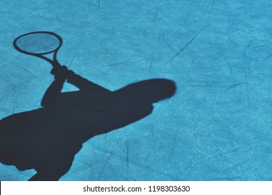 Shadow of woman tennis player, (shadow of player on the hard court)