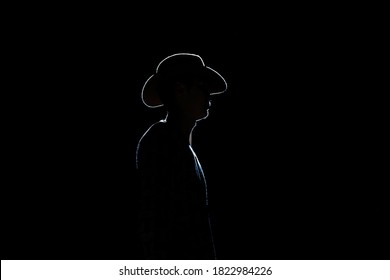 A Shadow-portrait Of Mongolian Man With A Fedora Hat. 