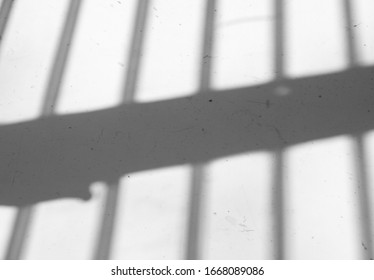 Shadows of jail cell bars