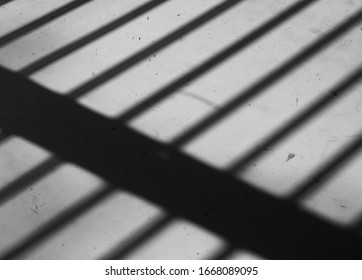 Shadows of jail cell bars