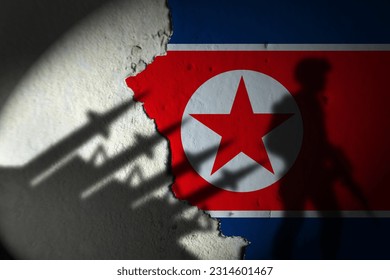 Shadows of North Korean missiles and soldiers on the wall. - Shutterstock ID 2314601467
