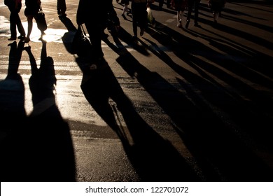 Shadows Of People Walking Street In Morning Light