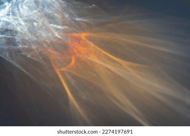 Shadows and reflections of light - soft or selective focus, defocus. Abstract background, whimsical pattern of light through a glass object. Selective focus