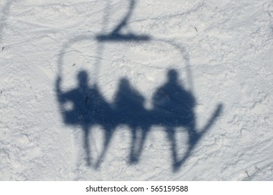 Shadows Of Three Skiers -- From A Chairlift