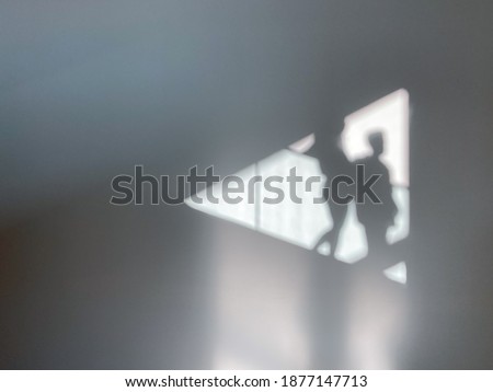 Shadows of two people in triangular shape