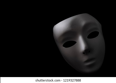 Shadowy Disguise, Secret Society And Creepy Emotionless Figure Concept With A Vintage White Blank Mask With Dramatic Light And Dark Shadow Isolated On Black Background With Copy Space