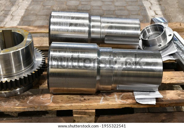 Shaft and gear on a rack after turning, milling\
and gear cutting on a\
machine.