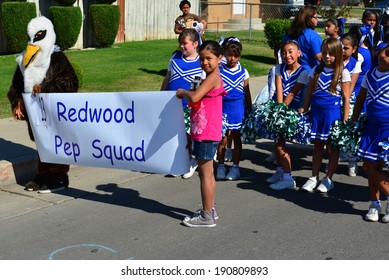 SHAFTER, CA - MAY 3, 2014: These Little Girls, Members Of The Redwood School's Pep Squad,  Are On Their Way To March In The Cinco De Mayo Celebration Parade.