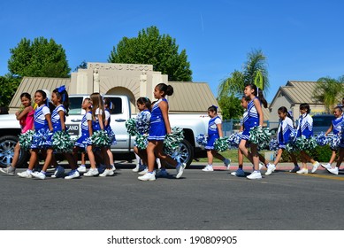 SHAFTER, CA - MAY 3, 2014: These Little Girls, Members Of The Redwood School's Pep Squad,  Are On Their Way To March In The Cinco De Mayo Celebration Parade.