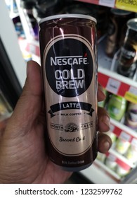 Shah Alam, Malaysia - 15 November 2018 :Hand hold a can of NESCAFE Cold Brew Latte flavoured drink for sell in the supermarket.