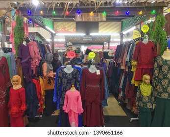 Shah Alam, Malaysia - 1st May 2019: A Woman Choose The Dress For Hari Raya Preparation