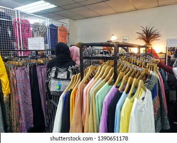 Shah Alam, Malaysia - 1st May 2019: A Woman Choose The Dress For Hari Raya Preparation