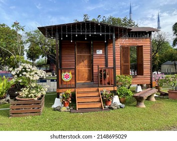 SHAH ALAM, MALAYSIA - April 21, 2022 :  View of a small traditional Malay house replica for taking photo in conjunction with the Hari Raya festival