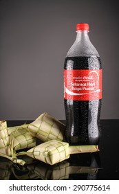 SHAH ALAM, MALAYSIA - JUNE 25 2015 : Coca Cola Festive Season With Greetings Selamat Hari Raya Puasa. The 1.5 Liter Coca Cola Decorated With Malay Tradition Food, Ketupat. 