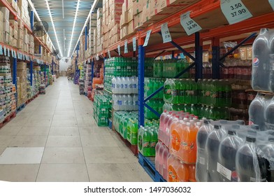 Shah Alam, Malaysia - September 5, 2019: Rows Of Bundles And Boxes Of Soft Drinks Stacked Inside Of The Warehouse. 