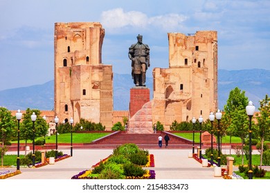 Shahrisabz, Uzbekistan - April 19, 2021: Tamerlane or Amir Timur monument and Ak-Saray or Ak Saray palace in the city of Shahrisabz in Uzbekistan